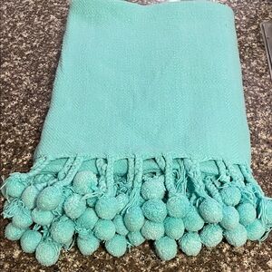 Karma Pom Pom Throw Blanket in Aqua